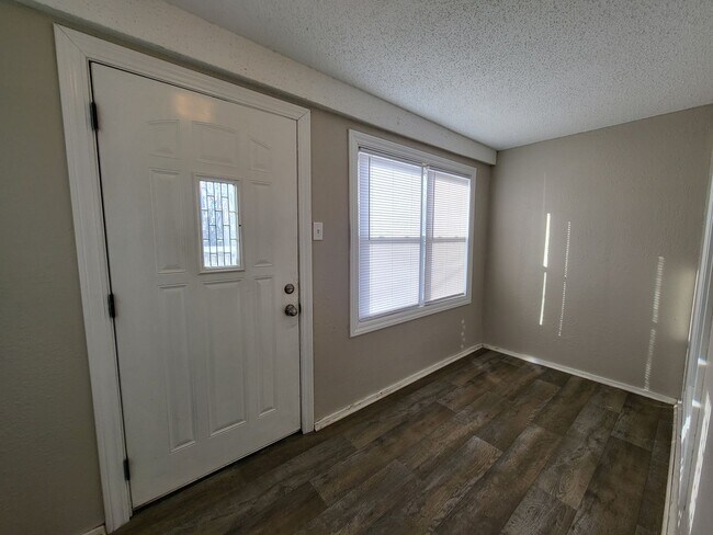 Building Photo - Two bedroom home with partially fenced yard!