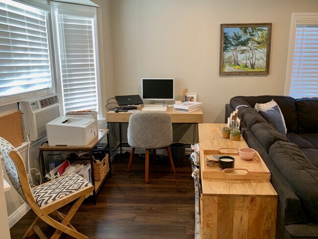 Spacious living room fits an office in front of bay window - 900 N El Molino Ave.
