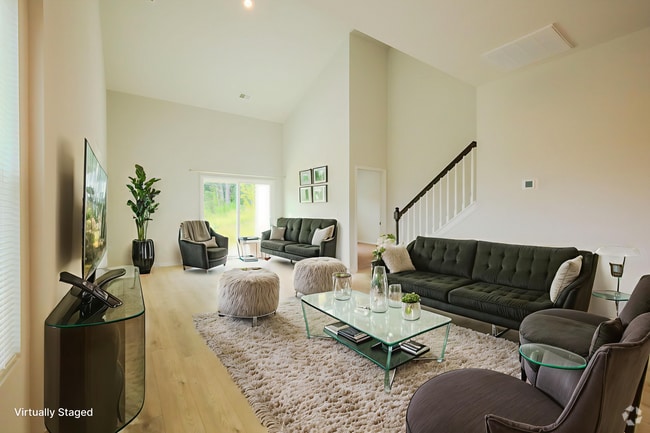 Living area with vaulted ceiling.Photo virtually staged. - 1542 Alvin Pond Dr