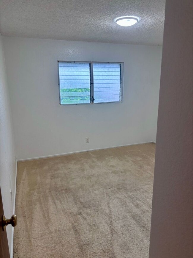 Building Photo - AVAILABLE NOW | 2 Bedroom, 1 Bathroom Townhome | Located at Waiau Garden Court Community | Includ...