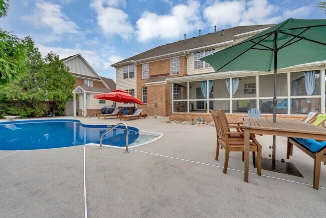 Building Photo - Beautiful brick home with a saltwater pool