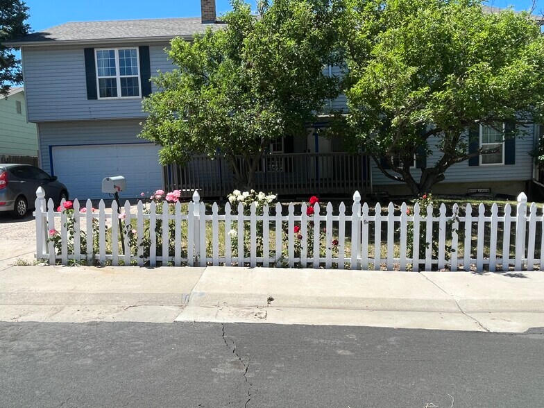 Property has new siding and the trees have been trimmed. We still have the lovely roses. - 17952 E Gunnison Pl