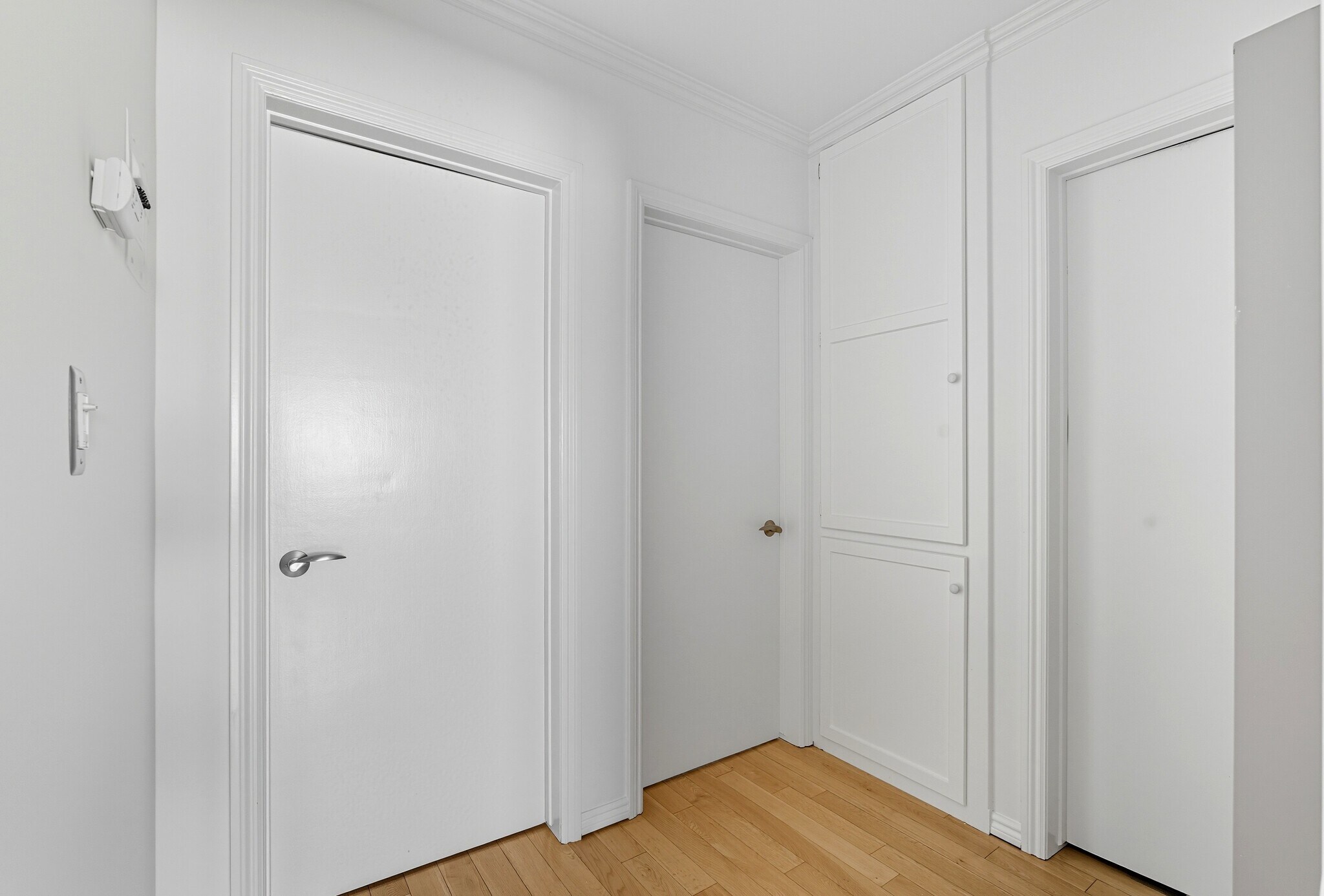 Hallway to bedrooms, with built in linen closet/storage - 1929 Tamarind Ave