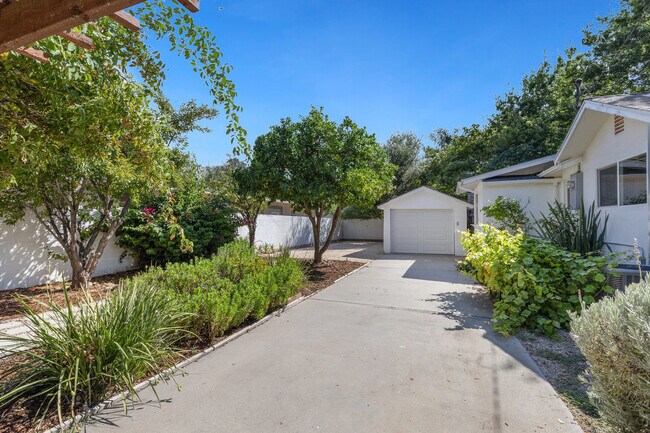 1 car garage on right side yard, long driveway can fit rv. - 228 N Pueblo Ave