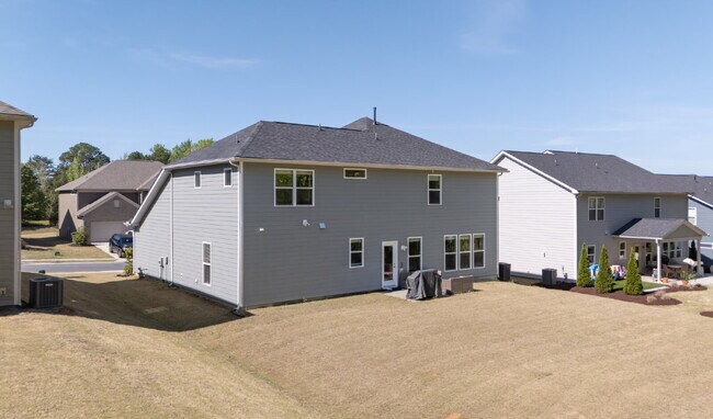 Building Photo - "Discover Spacious Living: 5-Bedroom Craftsman Home in Gated and Amenity-Rich Bretagne with Top-R...