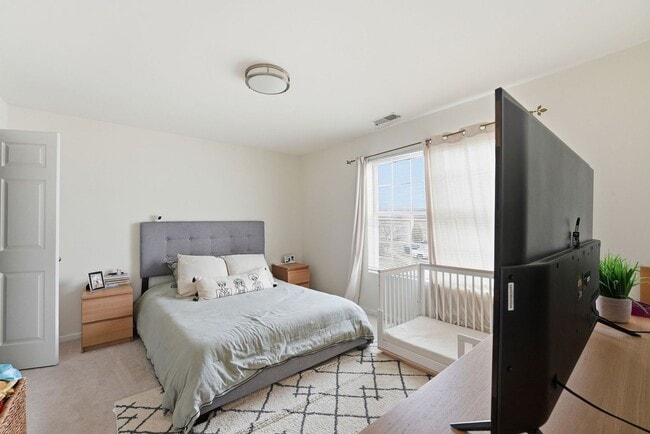 Building Photo - Bathed in natural light, this stunning second level condominium offers an effortless blend of com...