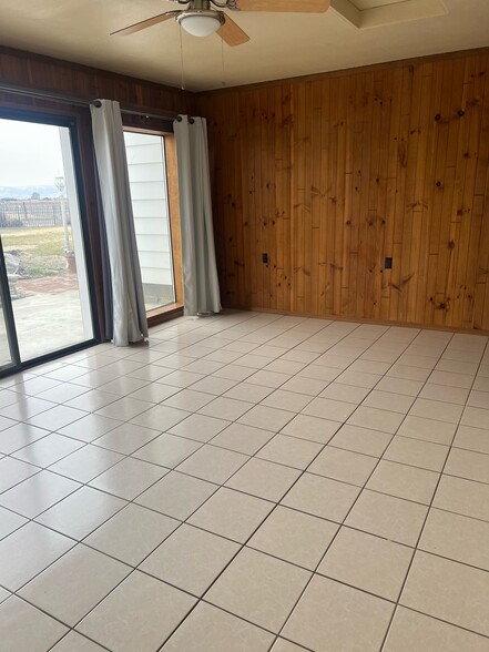 Living room has tile floors and great views. - 881 Bishop Rd