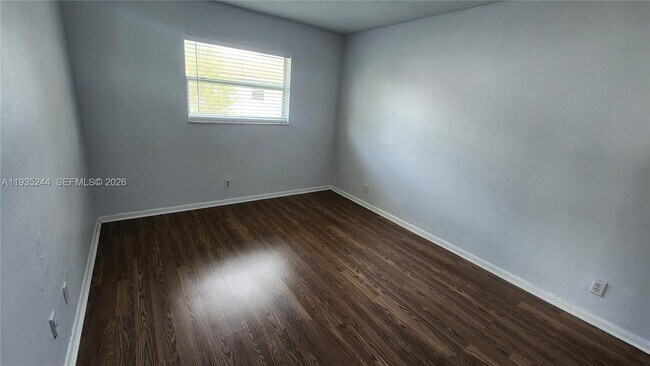 Building Photo - 3090 Coral Springs Dr