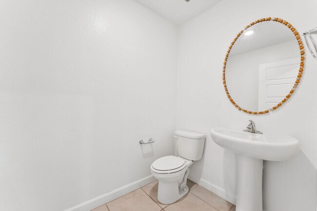 Building Photo - Modern Gated Townhome with Flexible Living Spaces & Stylish Finishes!