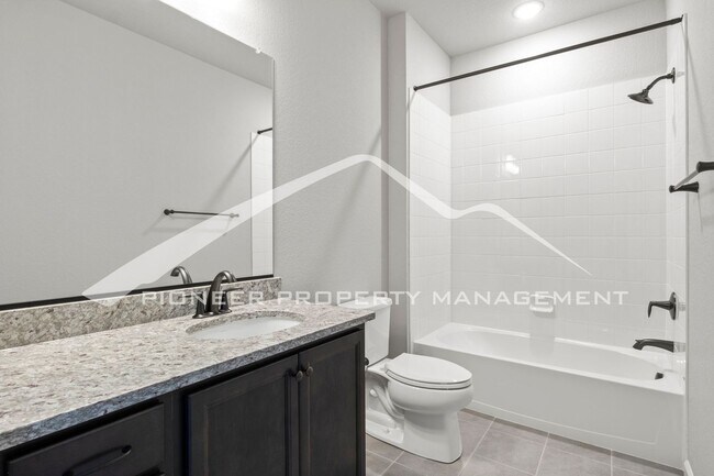 Building Photo - Contemporary Townhome in the Vibrant Interquest Low Maintenance Community with 2 car garage, Wash...