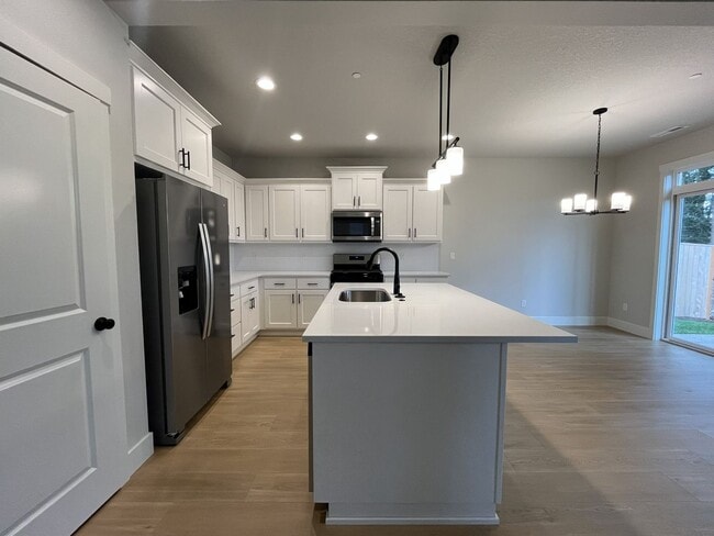 Building Photo - Modern 2025-Built 4 Bedroom Home with EV Charging, 5kW Solar, Open-Concept Living, Scenic Outdoor...