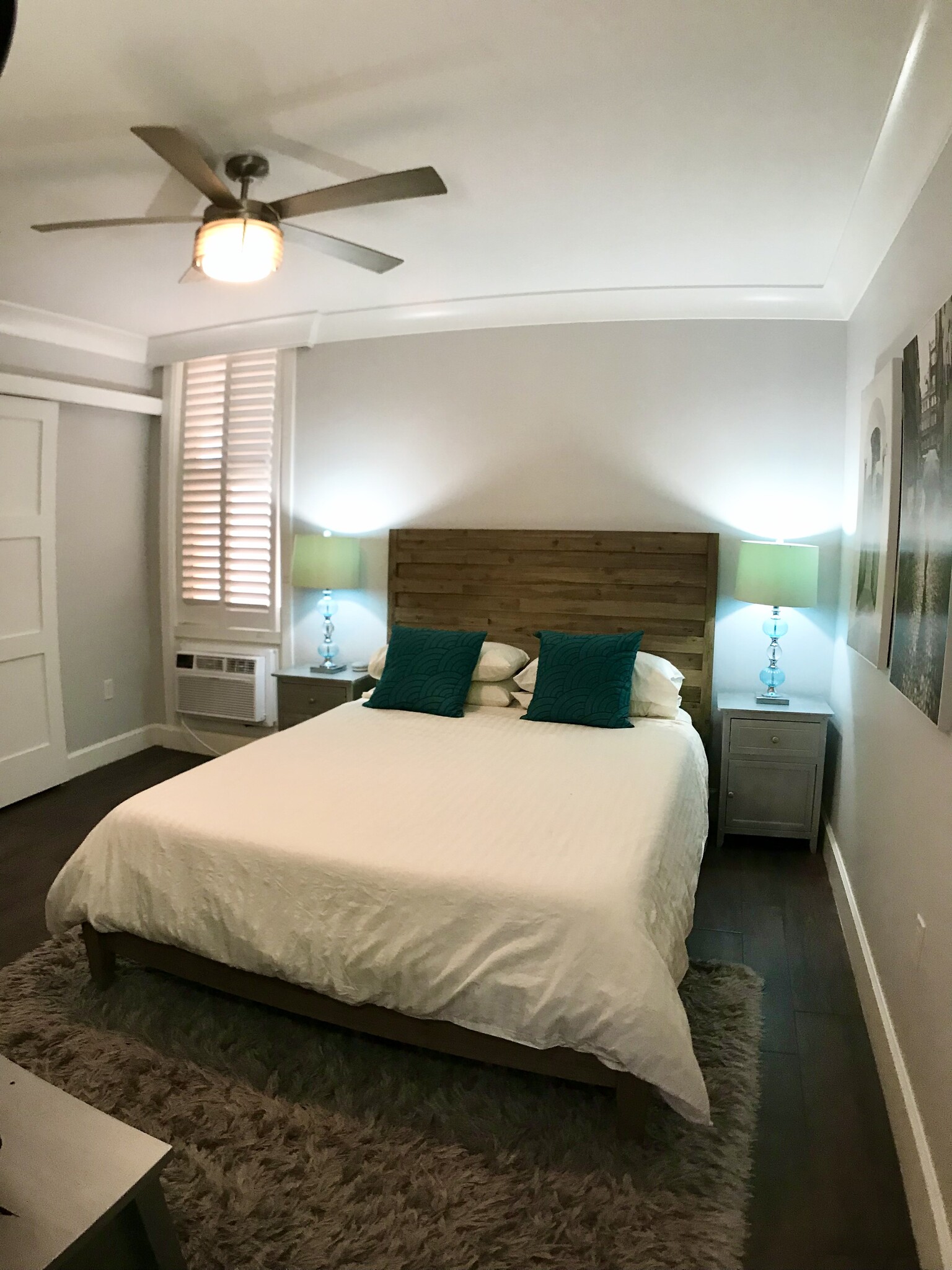 Bedroom window includes custom plantation shutters and frosted glass for added privacy. - 15 S Golfview Rd