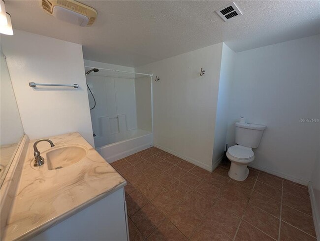 Building Photo - 6947 Bottle Brush Dr