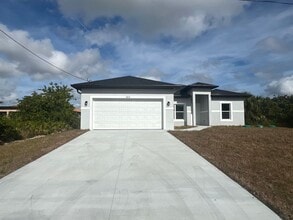 Building Photo - Brand new 4 bedroom 2 bath-2 car garage-SW LEHIGH ACRES