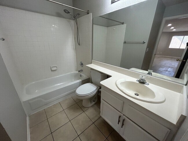 Building Photo - INVITING 2 BEDROOM TOP FLOOR CONDO IN A CE...