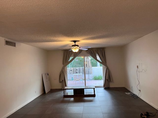 Large living room with access to outdoor patio. - 250 E San Jose Rd