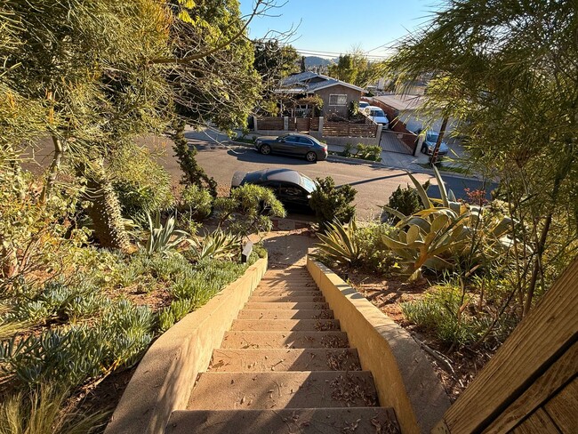 Building Photo - Hilltop Highland Park Sanctuary with Views, Private Gated Yard, In Unit Laundry, Parking & Abunda...