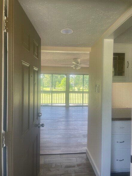 Entry to living room, kitchen on right - 1500 S Diamondhead Blvd