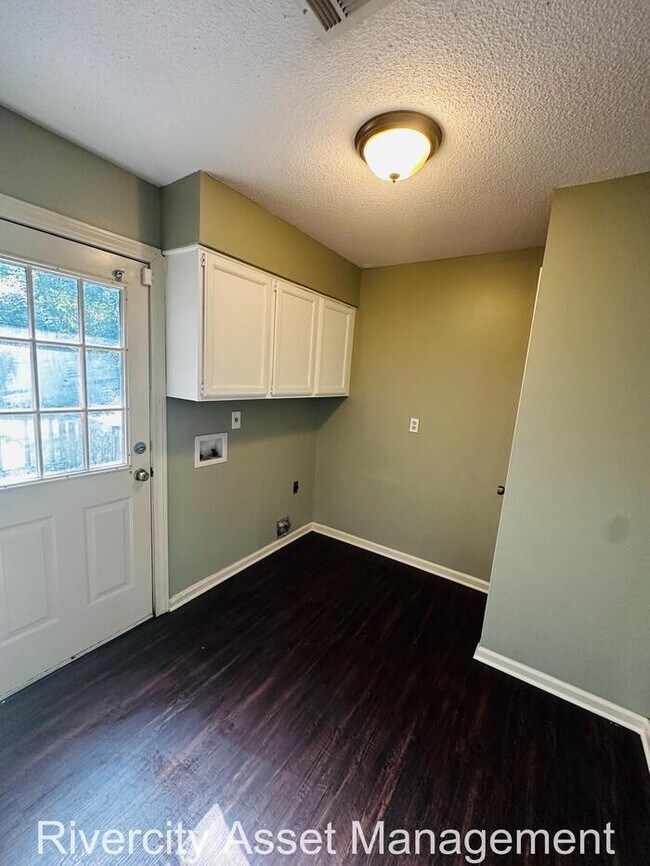 Building Photo - charming three-bedroom, two-full-bath resi...