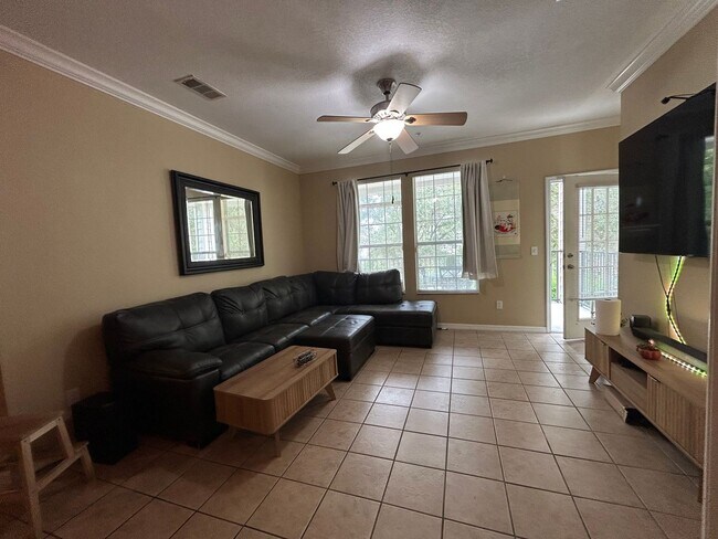 Building Photo - Walk to UF! Spacious & Furnished 3BD Condo...