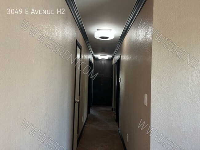 Building Photo - 3049 E Ave H10