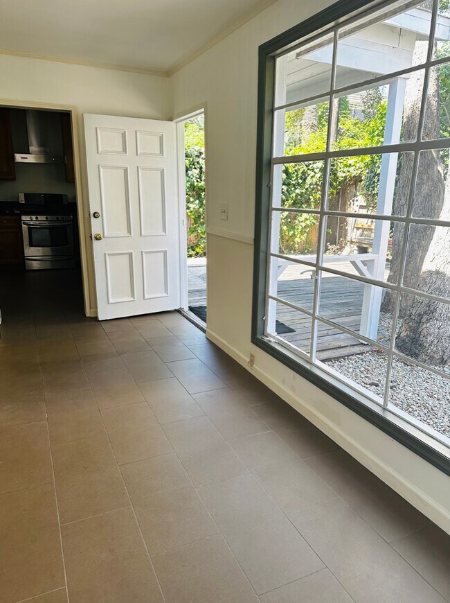Lots of windows in the front living room area providing natural lighting.. - 924 Nowita Pl
