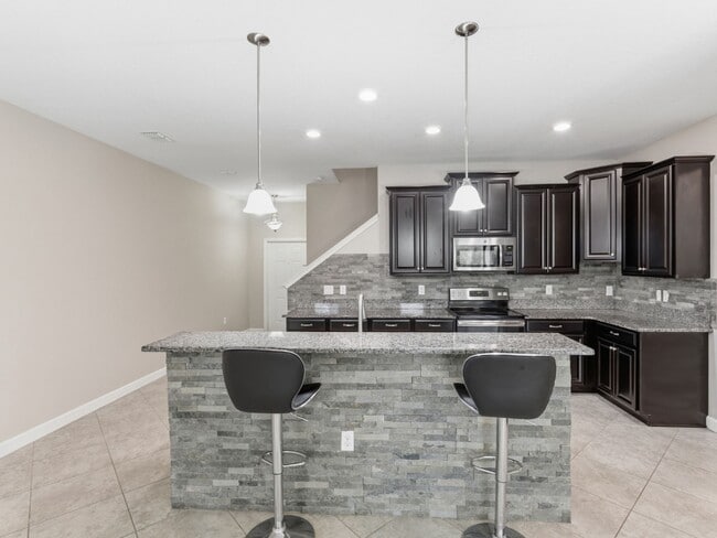 Building Photo - Stunning 3 BR + LOFT/2.5 BA /2-Car Garage townhome in the highly desirable GATED community of Hid...