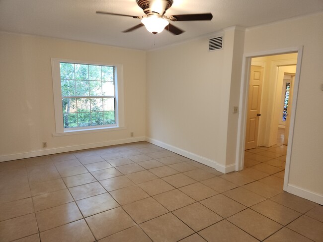 Living room leads to hallway leading to bath and bedrooms - 6906 Coach St