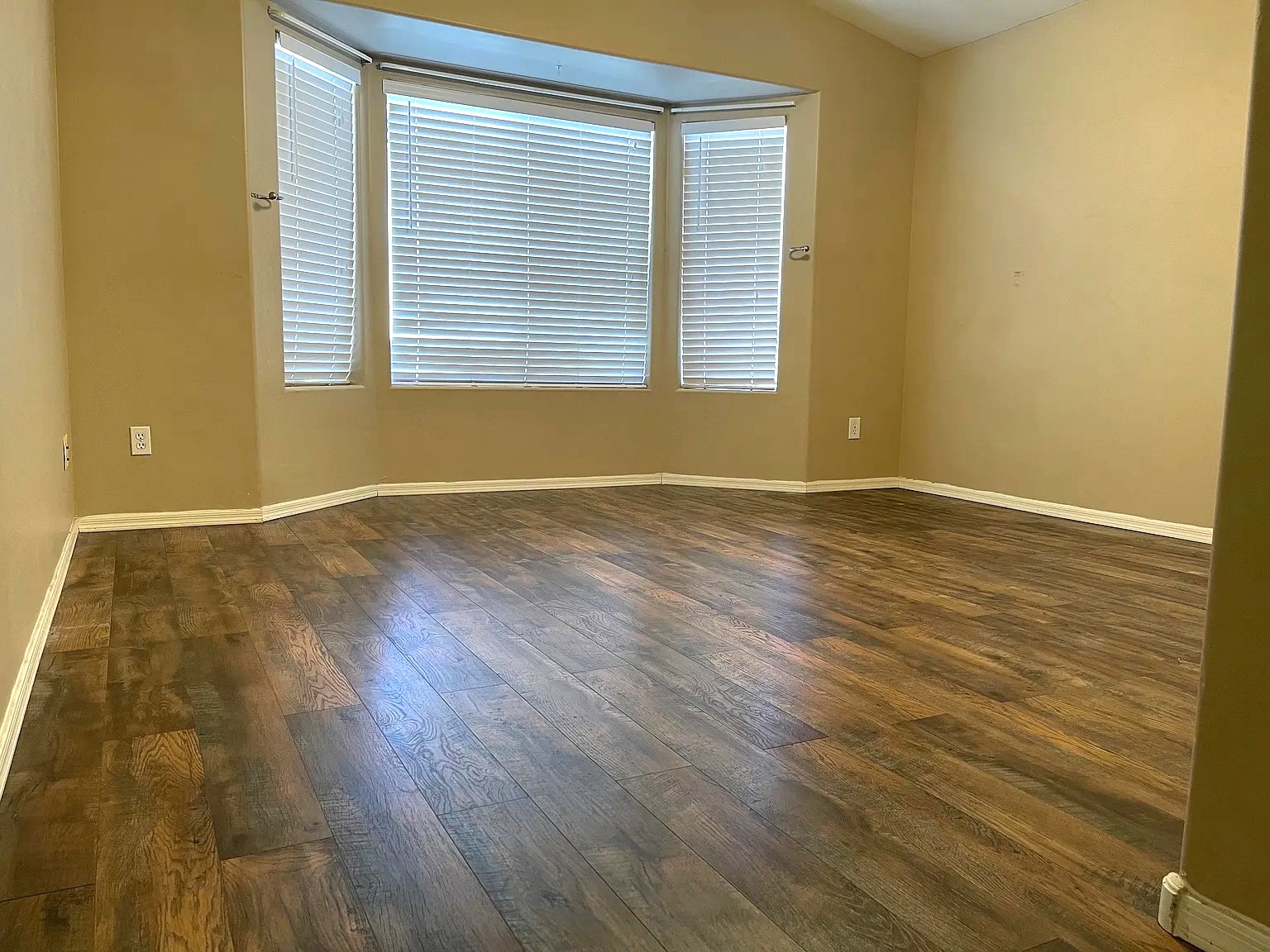 Master bedroom (13.5 by 13), newly installed floor with bay window - 10608 E Caballero St