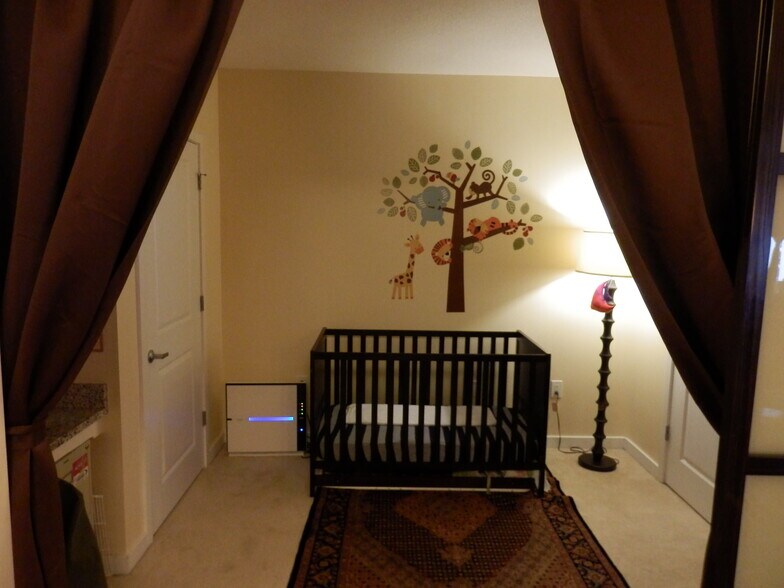 Den that can be used for office or guest bedroom. Has a sliding glass door with blackout curtains for privacy. The den has an attached 1/2 bathroom. - 475 K Street Northwest