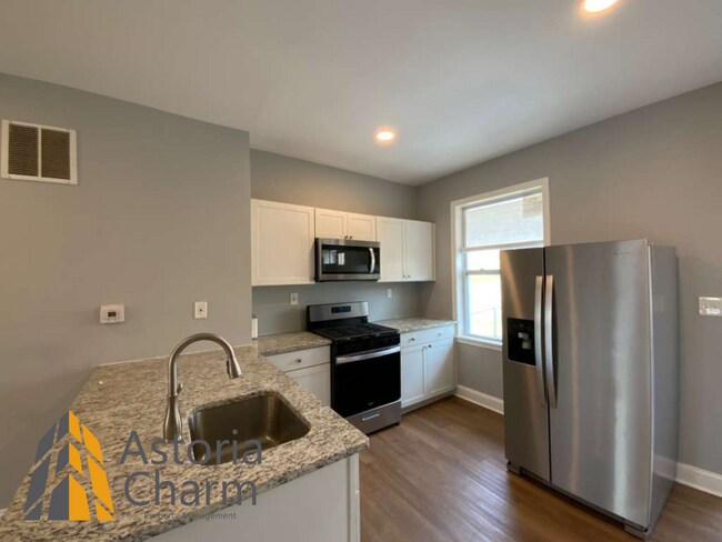 Building Photo - End Unit 3 Bedroom + Den with Backyard and Semi Finished Basement