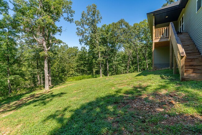 Building Photo - Nearly New Bella Vista Home Nestled in Ultimate Privacy! Furnished options available!