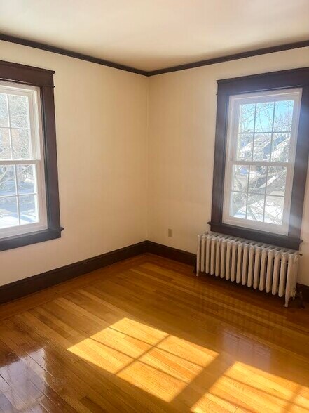 The living room with hardwood floors and sunlight all day - 52 Old Fort Rd