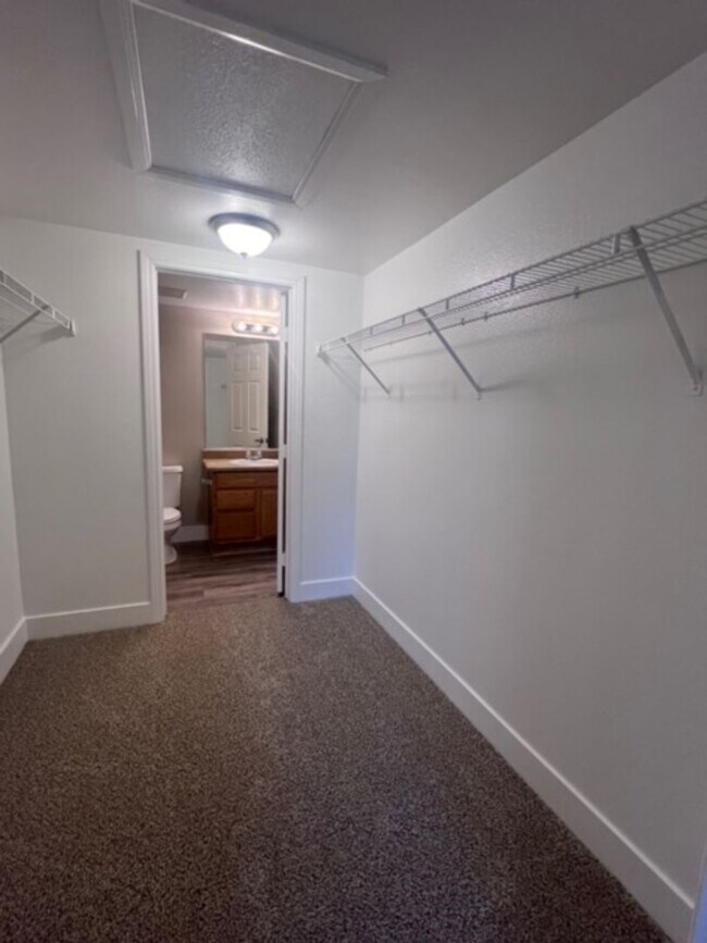 Building Photo - Three bedroom townhouse with 2 car garage