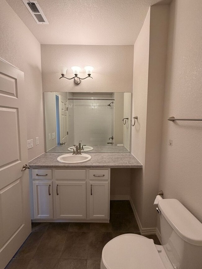 Building Photo - Move-In Ready 3-Story Townhome with Loft & 2-Car Garage