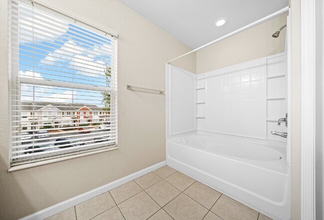 Building Photo - Corner Unit ~ Lake View ~ Maintenance Free...