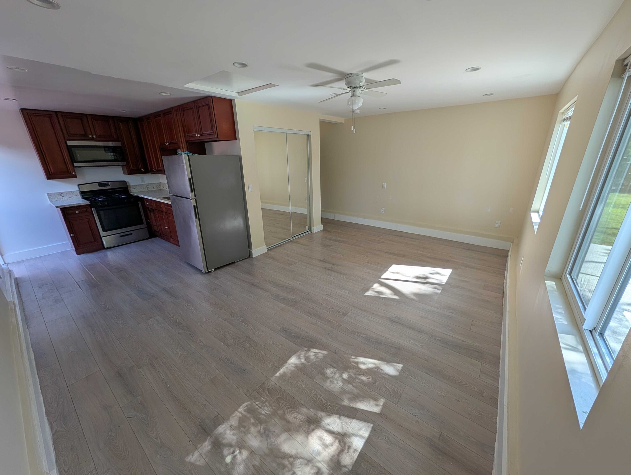 Living area with ceiling fan and mini-split AC - 6534 Peterson Ave