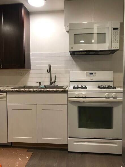Granite kitchen; stainless steel fridge: gas stove. - 3412 177th Pl SW