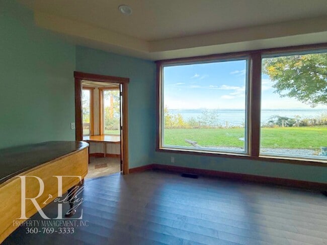 Building Photo - Waterfront Rustic Retreat with Vaulted Ceilings, Picture Windows & Lofted Nook