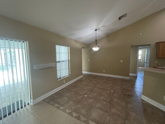 Building Photo - Spacious 4-Bedroom Pool Home – 2 Primary S...