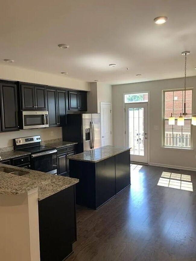 Building Photo - Modern 2BR + Office Townhome with Garage &...