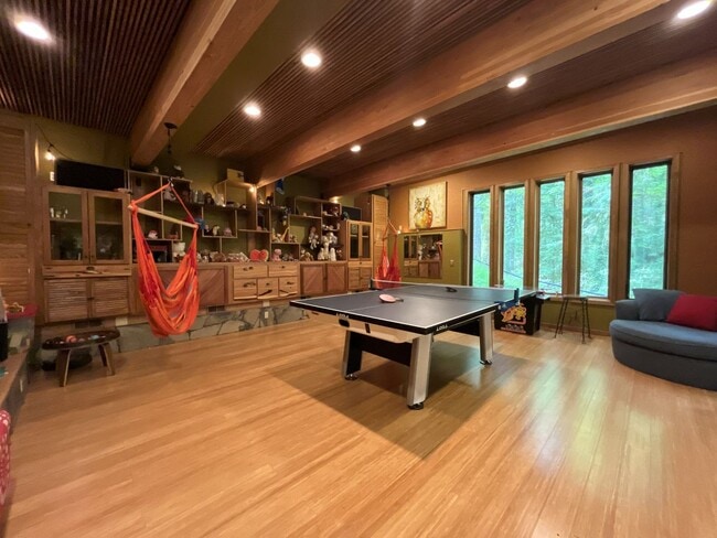 Building Photo - One-of-a-Kind Custom Home with Wall of Windows, Stone Fireplaces, Expansive Entertainment Space &...