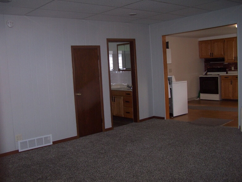 Showing Living Room, Small Closet to Left, Bathroom into Kitchen - 38545 County Road 104