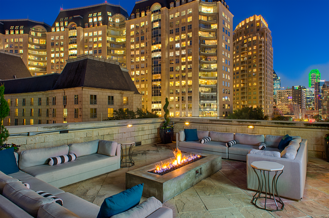 Luxury rooftop lounge with firepit and Uptown Dallas views - The Ashton