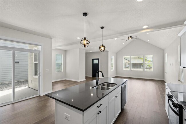 Building Photo - Brand New, Stylish 4-Bedroom Home with Vaulted Ceilings and Private Patio