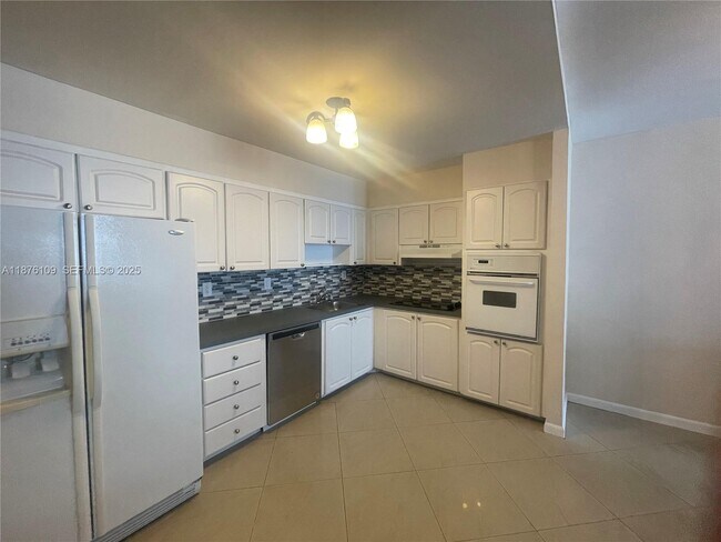 Building Photo - 19380 Collins Ave