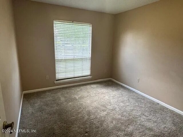 Building Photo - 7057 Swamp Flower Dr N