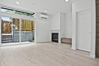 Building Photo - AVAILABLE AUGUST 14th! Modern Townhome w/ Private Balcony, AC, & Reserved Parking in Central Area