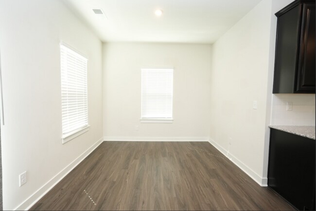Building Photo - This wonderful home has a covered rocking chair front porch