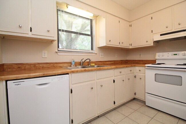 Building Photo - 2BR Home with Wood-Look Flooring, Fenced Backyard & Private Patio